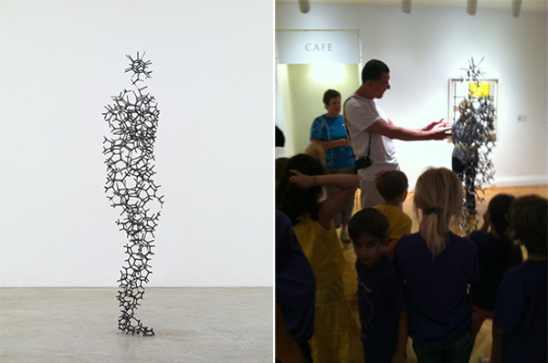 (left) Antony Gormley, Aperture XIII, 2010. Steel, 74 3/8 x 21 1/4 x 11 3/8 in. Private collection © Antony Gormley. Image courtesy Sean Kelly Gallery, New York. Photo: Stephen White, London. (right) Antony Gormley speaks with a group of children about his sculpture in the Phillips exhibition. Photo: Cecilia Wichmann