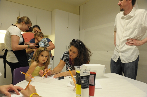 Photo of Jessica's family creating Jasper Johns-inspired prints in the art-making workshop