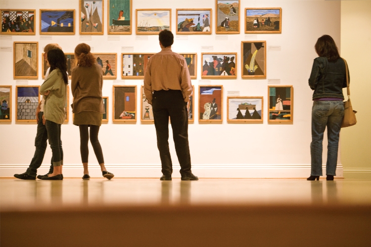 Visitors looking at Jacob Lawrence's The Migration Series (1941) at The Phillips Collection. Photo: Max Hirshfeld