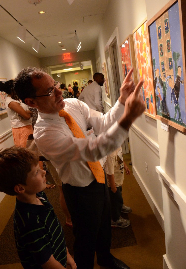 Photo of second grader Jonas and Phillips educator Paul Ruther during a community celebration at the Phillips in June 2012. Photo: James R. Brantley