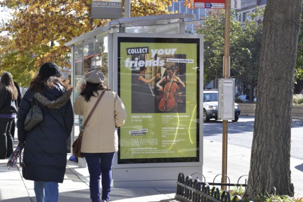 Photo of Phillips bus shelter advertisement - bright green featuring Sunday Concerts