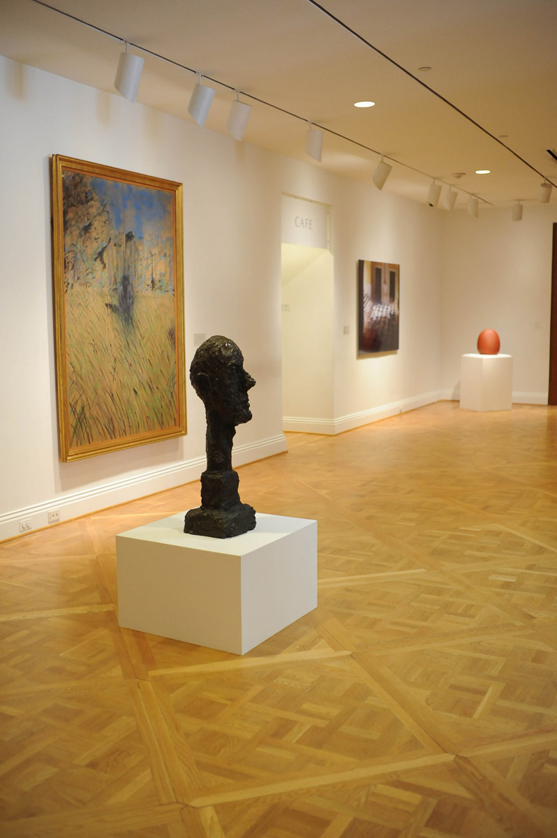 (works in the permanent collection from left) Francis Bacon, Study of a Figure in a Landscape, 1952; Alberto Giacometti, Monumental Head, 1960; James Casebere, Yellow Hallway #2, 2001; Juan Hamilton, Bruja, 1988. Photo: Joshua Navarro