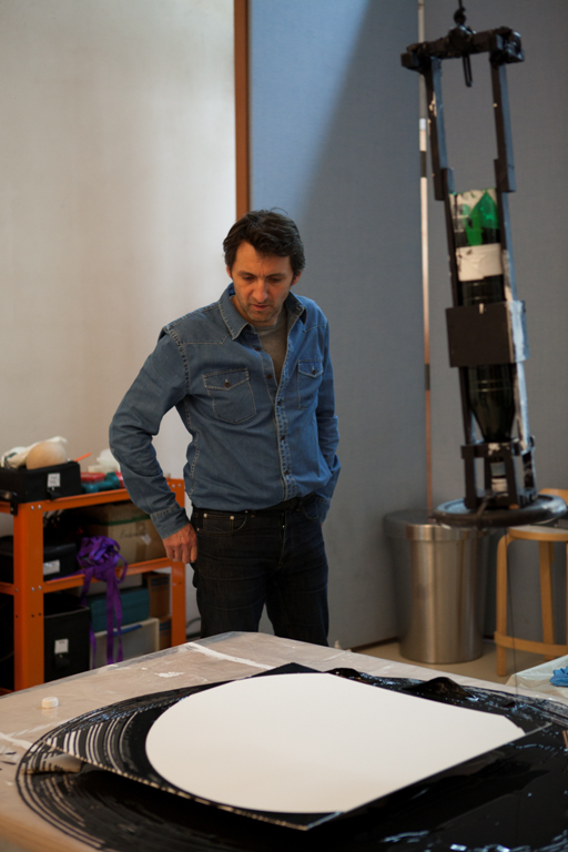 Xavier Veilhan in his studio with a work from Pendule-Drippings series. Photo: Vesela Sretenovic