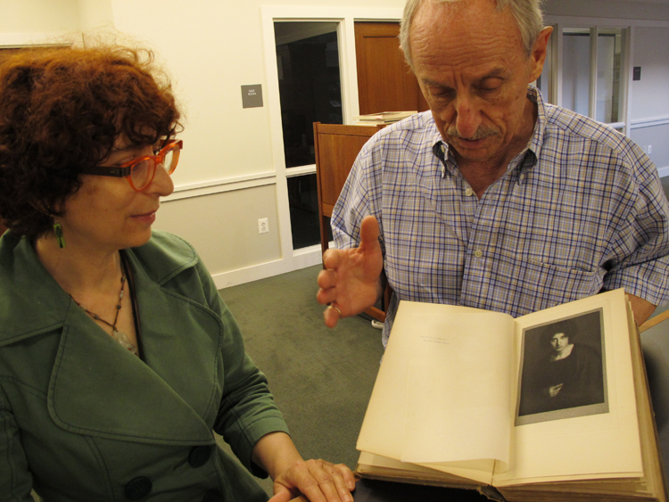 Head Librarian Karen Schneider with Raymond Machesney, displaying a photogravure plate by Alvin Langdon Coburn.