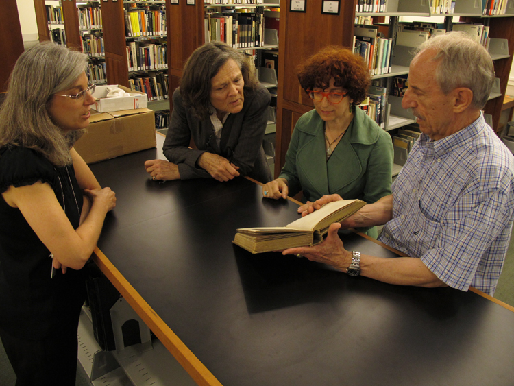 (left to right) Elsa Smithgall, Eliza Rathbone, Karen Schneider, and Raymond Machesney in the library.