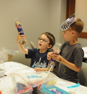 Young visitors showing off their wonderful creations! Photo credit: Joshua Navarro