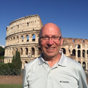 Chuck McCorkle in front of The Colloseum in Rome, Italy.