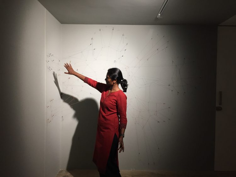 Ranjani Shettar looking at an installation in progress.